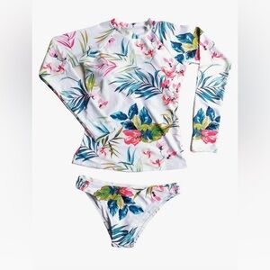 Two piece women’s long sleeve and bikini bottom swimsuit